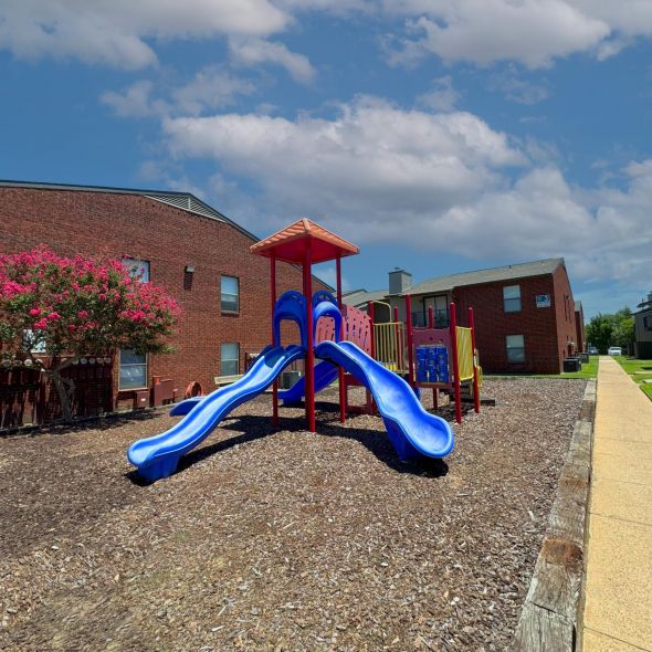 South Meadows red and blue colored playground with two slides.